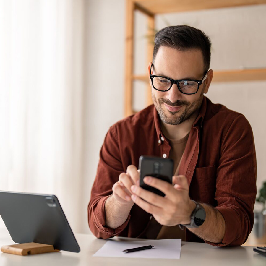 person smiling at phone 900x900