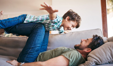 adult playing with child 767x418