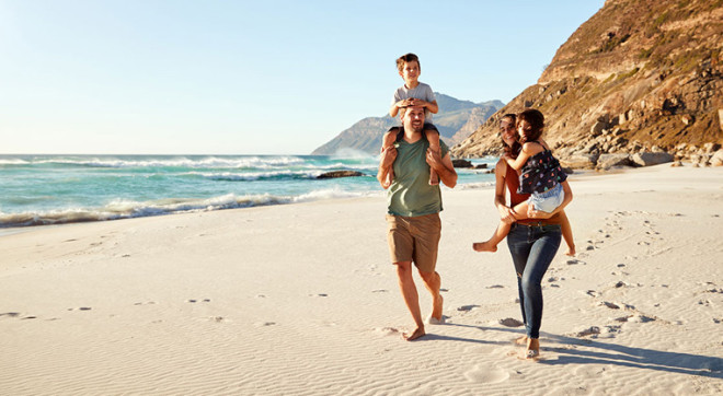 family on beach 767x418