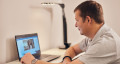 Person having an online consultation at home on their laptop