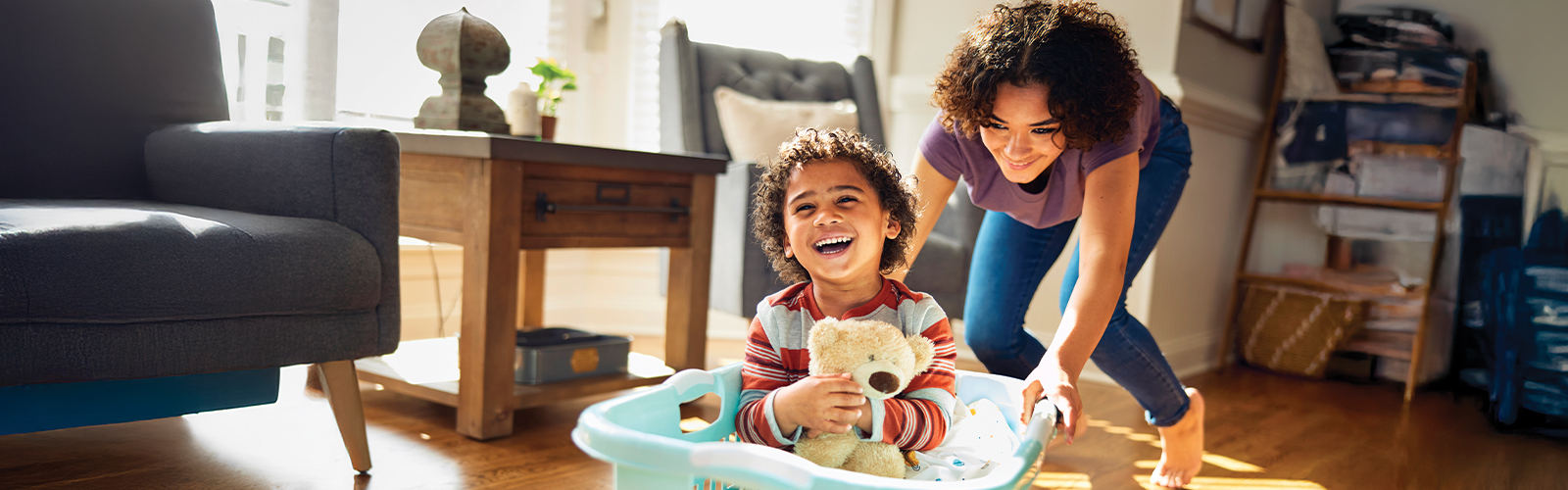 mother playing with child 1600x500