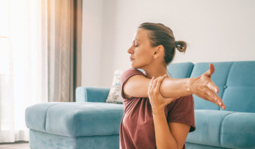 woman practices yoga at home