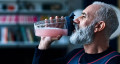 man drinking smoothie
