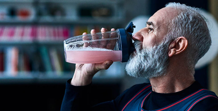 man drinking smoothie